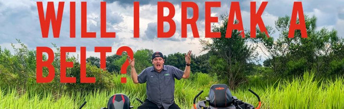 Comparison showdown between Toro Timecutter and Bad Boy ZT Elite mowers in lush field.